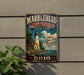 A vintage-style metal sign for the Marblehead Lighthouse State Park in Ohio, featuring a lighthouse and a scenic landscape.
