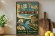 A vintage-style poster of Mark Twain, the famous American author, is displayed on a wall next to a wooden cutting board and some potted plants.