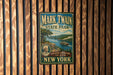 A vintage metal sign for Mark Twain State Park in New York, featuring a scenic illustration of a river and a steamboat, with the text "Discovery Adventure and History" and "New York" below.