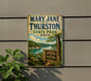 A vintage-style metal sign for Mary Jane Thurston State Park in Ohio, featuring a scenic landscape with a lake and trees.