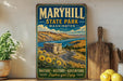 A vintage-style sign for Maryhill State Park in Washington, featuring a scenic landscape with a winding road, mountains, and a river.