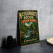 A vintage metal sign for Mashamogueet Brook State Park in Connecticut, featuring a scenic illustration of a river and forest.