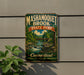 A vintage metal sign for Mashamogue State Park, featuring a scenic landscape with a river, bridge, and trees.
