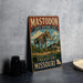 A vintage-style metal sign for the Mastodon State Historic Site in Missouri, featuring an illustration of a skeleton of a mastodon and the text "IMMERSE YOURSELF IN PREHISTORY MISSOURI".