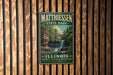 A vintage metal sign for Matthiessen State Park in Illinois, featuring a scenic image of a waterfall surrounded by lush greenery.
