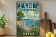 a vintage-style sign for Mauhee Bay State Park in Ohio, with a scenic illustration of a lake, sailboat, and birds.