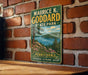 A vintage-style metal sign for Maurice K. Goddard State Park in Pennsylvania, featuring a scenic landscape with a lake and mountains.