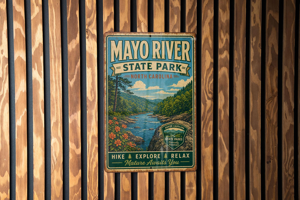 A vintage metal sign for Mayo River State Park in North Carolina, featuring a scenic illustration of the river surrounded by lush greenery.