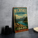 A vintage-style metal sign for McCroskey State Park in Idaho, featuring a scenic landscape with mountains, pine trees, and a lake.