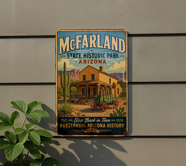 A vintage-style metal sign for McFarland State Historic Park in Arizona, featuring a desert landscape with a cactus and a horse-drawn carriage.