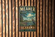 A vintage-style metal sign for Meacher State Park in Alabama, featuring a bird and a scenic landscape.