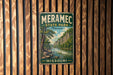 A vintage metal sign for Meramec State Park in Missouri, featuring a scenic landscape with a river and trees.