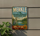 A vintage metal sign for the Merkle Natural Resources Management Area in Maryland, featuring a bird and a landscape scene.