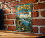 A vintage-style metal sign for Merrick State Park in Wisconsin, featuring a scenic landscape with a river, cliffs, and pine trees.
