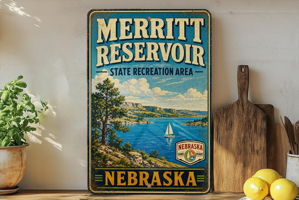 A vintage-style sign for the Merritt Reservoir State Recreation Area in Nebraska, featuring a scenic landscape with a lake, mountains, and a sailboat.