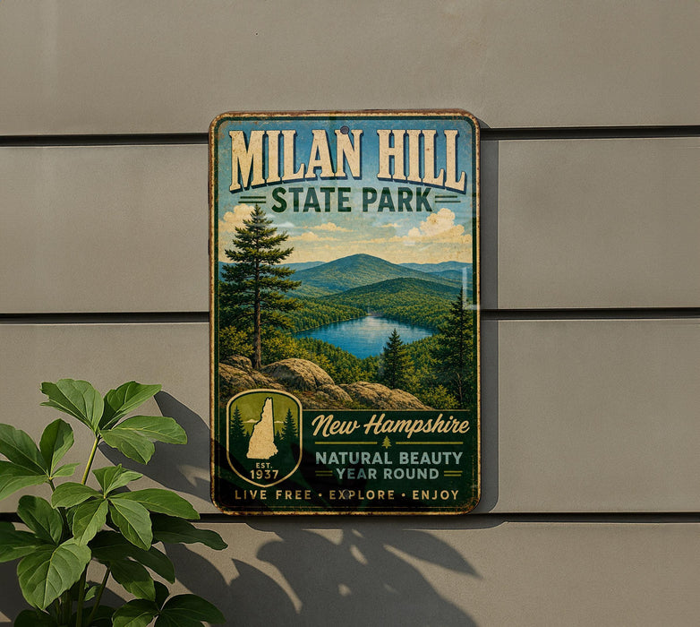 A vintage-style metal sign for Milan Hill State Park, featuring a scenic landscape with mountains, trees, and a lake.