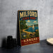 A vintage metal sign for Milford State Park in Kansas, featuring a scenic image of a lake, sailboat, and mountains.