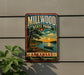 A vintage-style metal sign for Millwood State Park in Arkansas, featuring a scenic landscape with a lake, trees, and a sunset.