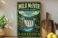 A vintage-style sign for Milo McIver State Park in Oregon, featuring a scenic illustration of a waterfall surrounded by lush greenery.