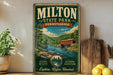 A vintage-style poster advertising Milton State Park in Pennsylvania, featuring a scenic landscape with a covered bridge and a river.
