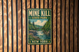 A vintage-style metal sign for Mine Kill State Park in New York, featuring a scenic landscape with a waterfall and forest.