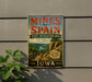 A vintage-style sign for the state recreation area in Iowa, featuring a scenic landscape with a bridge and a river.