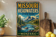 A vintage-style metal sign for Missouri Headwaters State Park, featuring a scenic mountain landscape with a river and pine trees.