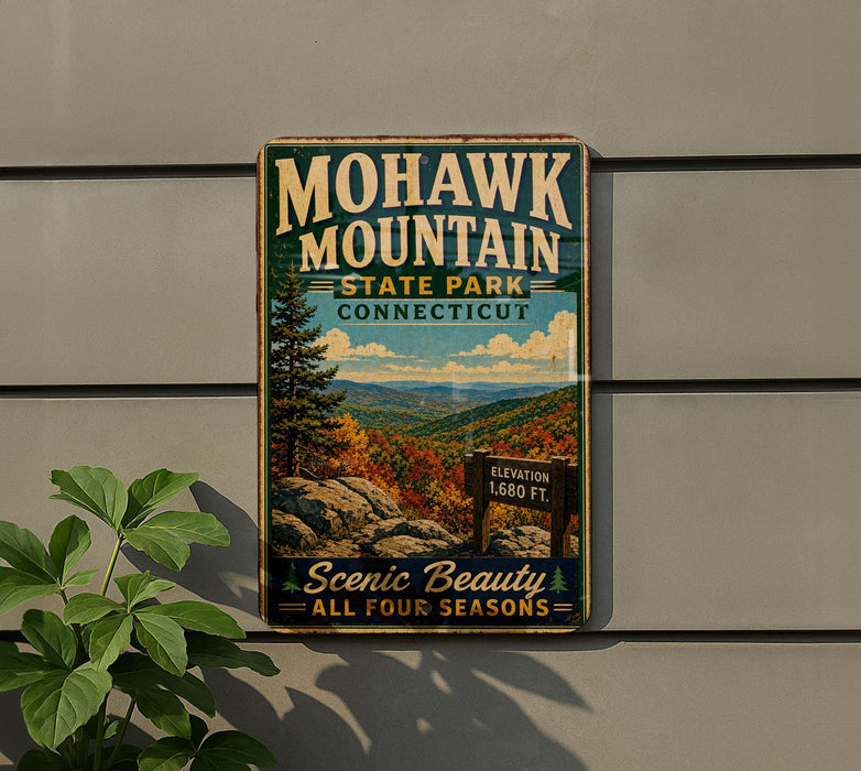 A vintage-style metal sign for Mohawk Mountain State Park in Connecticut, featuring a scenic mountain landscape and the text "Scenic Beauty All Four Seasons".