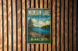 A vintage metal sign for Monson Lake State Park in Minnesota, featuring a scenic landscape with a lake, trees, and a canoe.