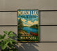 A vintage-style sign for Monson Lake State Park in Minnesota, featuring a scenic landscape with a lake, pine trees, and a canoe.