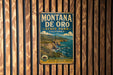 A vintage metal sign for Montana de Oro State Park, California, featuring a scenic coastal landscape with cliffs and the ocean.
