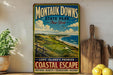 A vintage-style metal sign for Montauk Downs, New York, featuring a scenic coastal landscape with a golf course and ocean in the background.