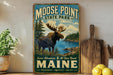 A vintage-style sign for Moose Point State Park in Maine, featuring a moose in a forest landscape with a lake in the background.