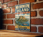 A vintage-style metal sign for Mormon Island, the State Recreation Area in Nebraska, featuring a scenic illustration of a mountain and a lake with a boat.