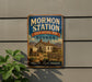 A vintage-style metal sign for Mormon Station, a historic park in Nevada, featuring a depiction of a historic home and mountains in the background.