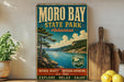 a vintage-style sign for Moro Bay State Park in Arkansas, with a scenic landscape depicting a lake and mountains. The sign is displayed on a shelf, surrounded by various kitchen utensils and a potted plant.