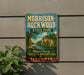 A vintage metal sign for Morrison-Rockwood State Park in Illinois, featuring a scenic landscape with a river and cliffs.
