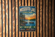 A vintage-style metal sign for Mosquito Lake State Park in Ohio, featuring a scenic landscape with a lake, trees, and a boat.