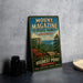 A vintage-style metal sign for Mount Magazine, featuring a scenic mountain landscape with a pine tree and a rocky cliff.