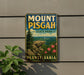 Mount Pisgah State Park sign on a wall, with a plant to the left.