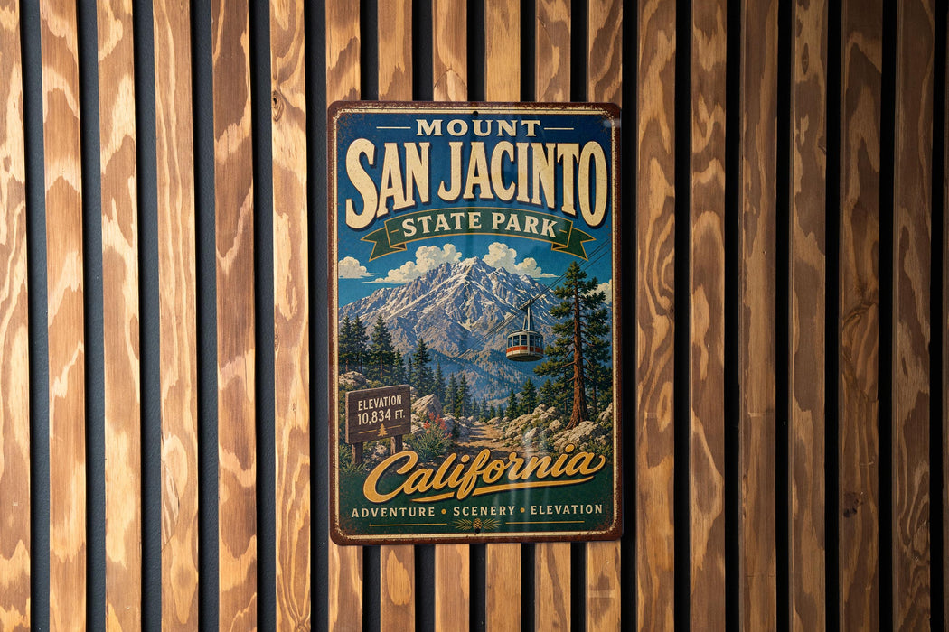 A vintage metal sign for Mount San Jacinto State Park, featuring a scenic mountain landscape with a ski lift and the text "California Adventure Scenery Elevation".