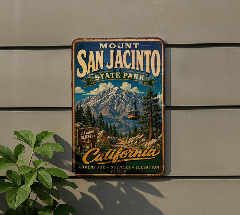 A vintage metal sign for Mount San Jacinto State Park in California, featuring a scenic mountain landscape with a ski lift.