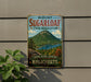 A vintage-style metal sign for Mount Sugarloaf State Reserve in Massachusetts, featuring a scenic mountain landscape with a lake and pine trees.