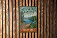 A vintage-style metal sign for Mouselail Landing State Park in Tennessee, featuring a scenic image of a lake and mountains.