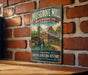 A vintage-style metal sign for Musgrove Mill, a historic site in South Carolina, mounted on a brick wall.