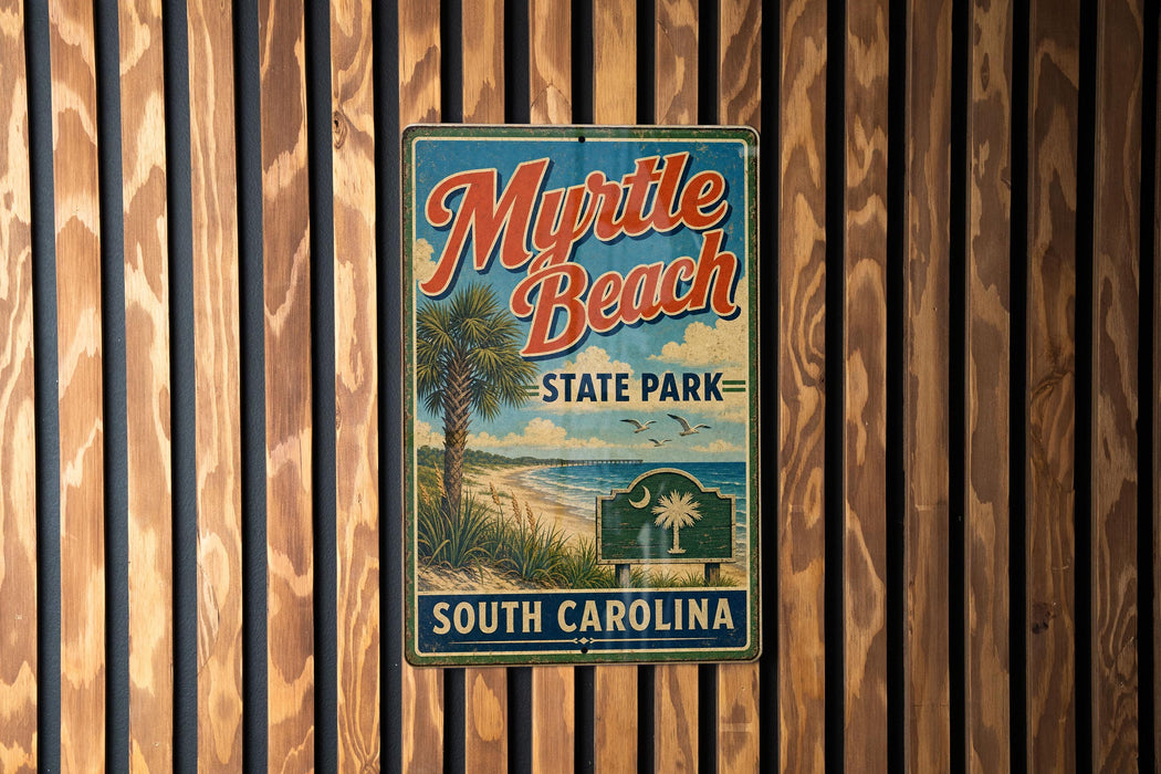 A vintage-style metal sign for Myrtle Beach State Park in South Carolina, featuring a palm tree and beach scene.
