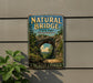 A vintage-style metal sign for the Natural Bridge State Park in Massachusetts, featuring a scenic image of the arch and a path leading through the landscape.