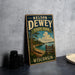 A vintage-style metal sign for Nelson Dewey State Park in Wisconsin, featuring a scenic landscape with a lake and pine trees.