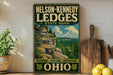 A vintage-style sign for Nelson-Kennedy Ledge State Park in Ohio, featuring a scenic landscape with a cliff and trees.