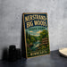 A vintage-style sign fornersand-big-woods state park in Minnesota, featuring a scenic illustration of a forest and a waterfall.